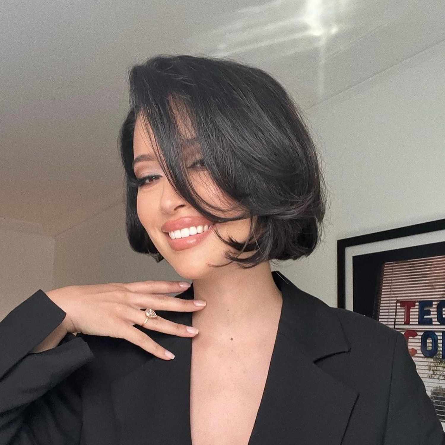 Actor Christian Serratos with a thick, layered, fluffy bob
