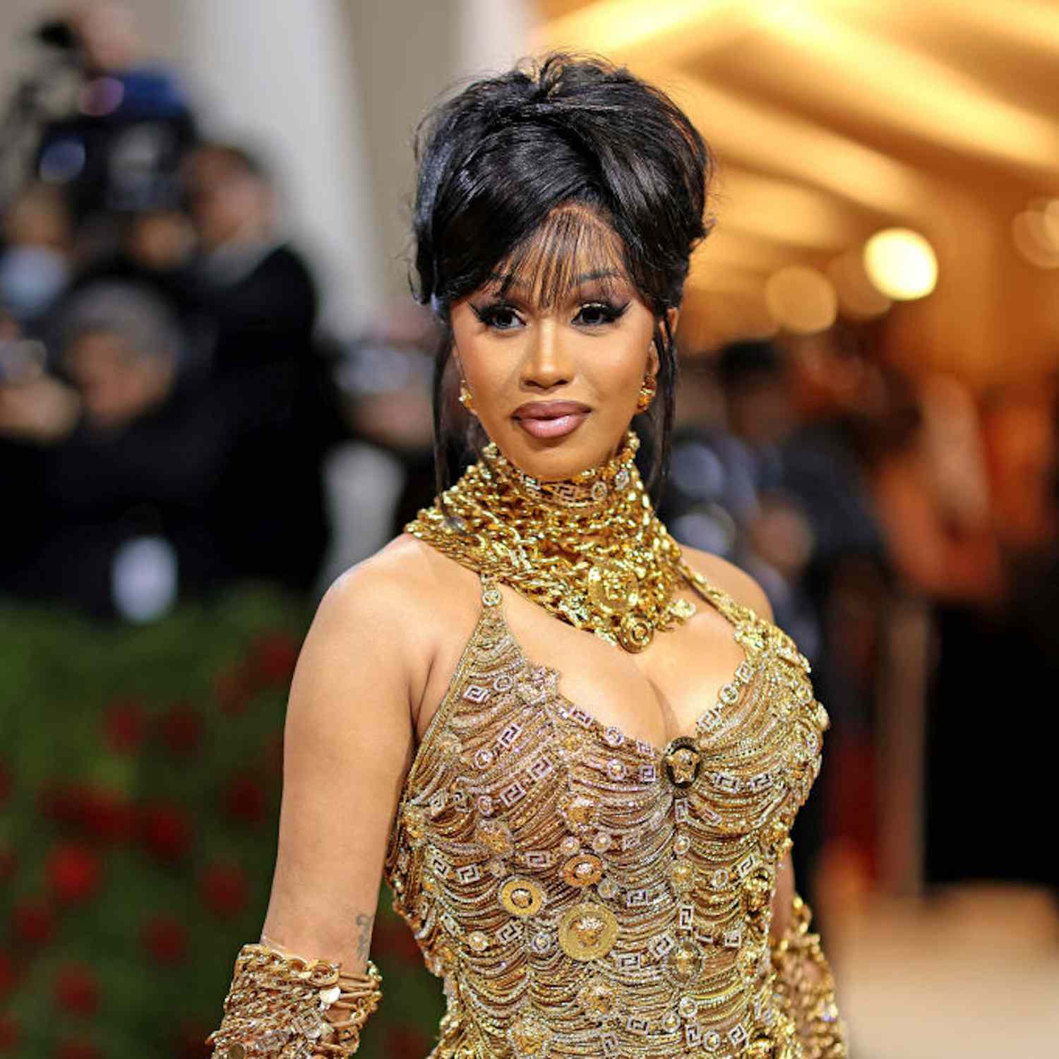 Cardi B with a wispy updo with fringe