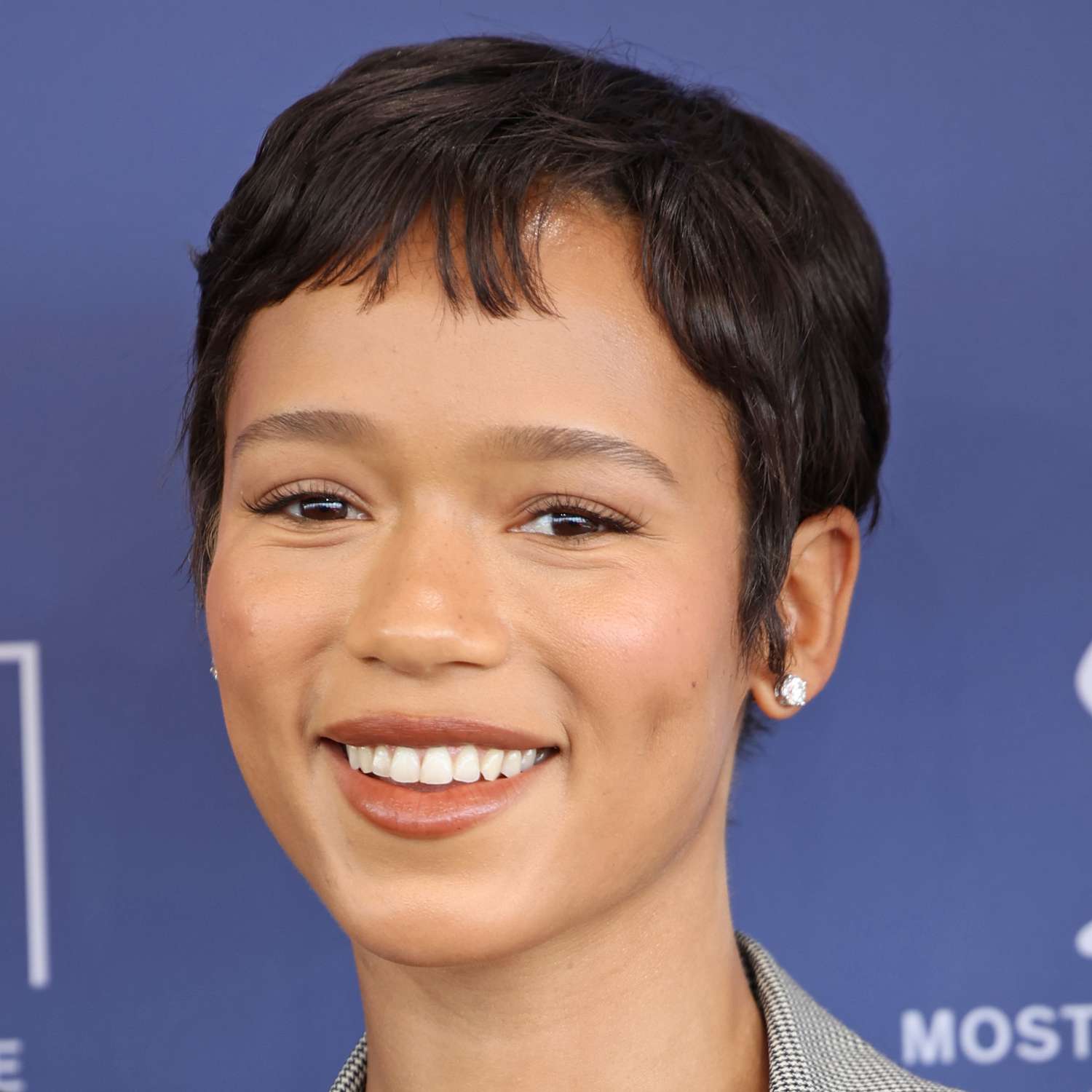 Taylor Russell attends an event with an espresso brunette pixie