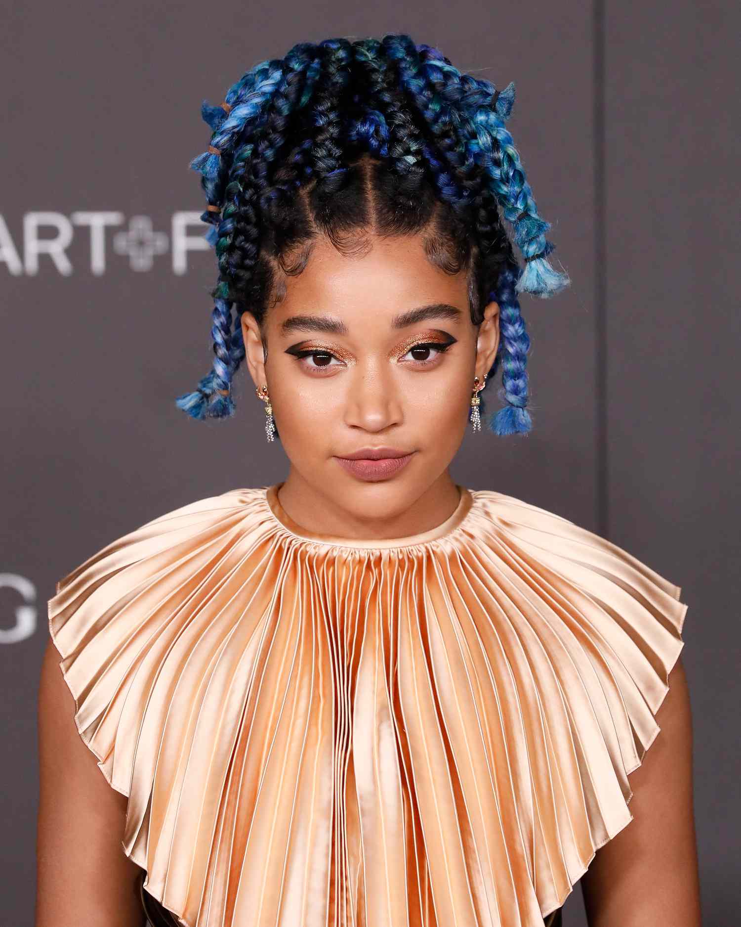 Amandla Stenberg with blue-based black hair.