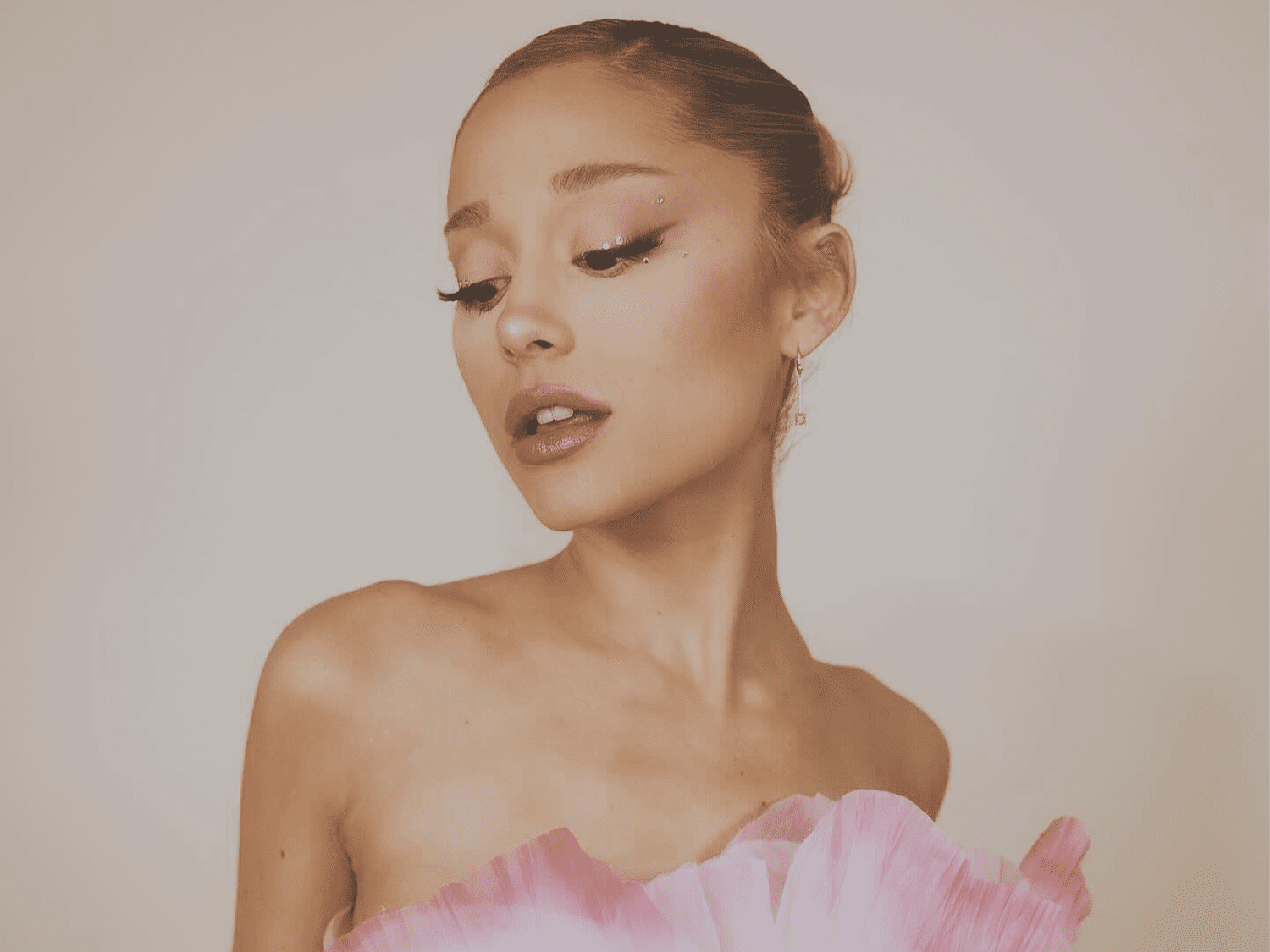 Ariana Grande wearing a pink dress