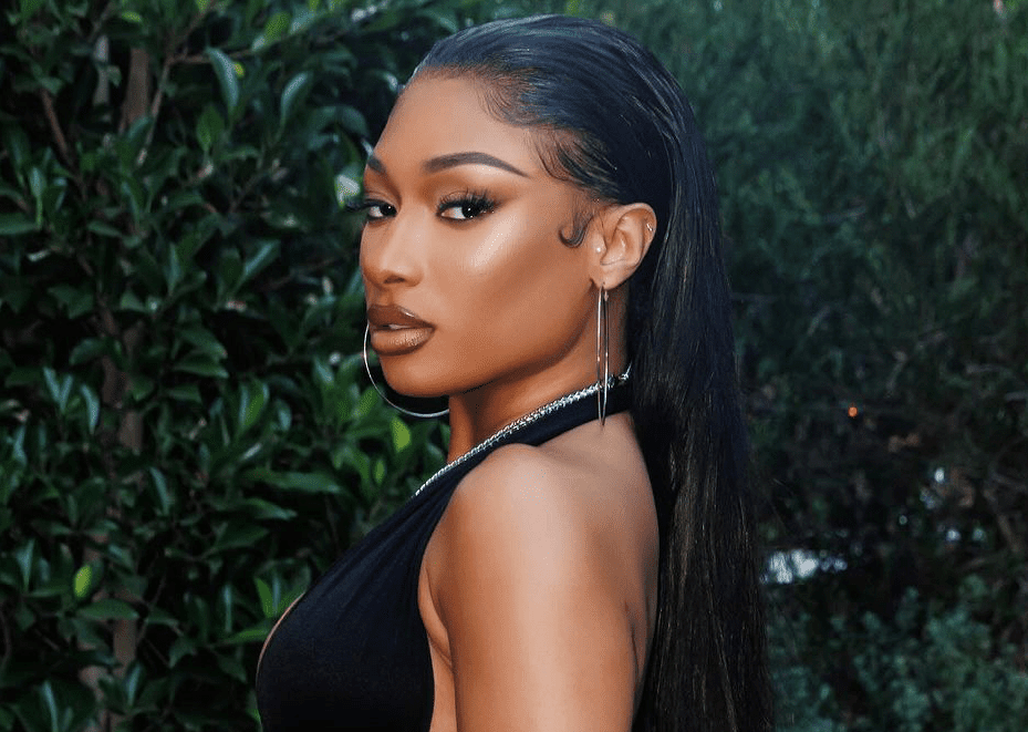 Megan Thee Stallion with slicked-back hair. 